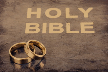 Wall Mural - Wedding rings on bible