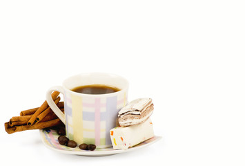 Poster - Coffee cup with sweets an cinnamon on white background