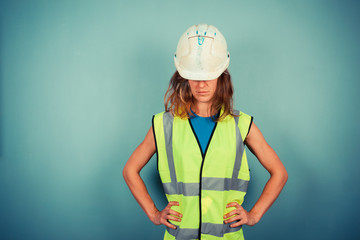 Wall Mural - Young female engineer in high vis and hardhat