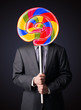 © ra2 studio - Businessman holding a lollipop
