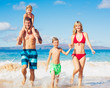 © EpicStockMedia - Happy Family at the Beach