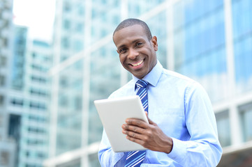 Middle aged businessman using a tablet