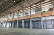 Big automated warehouse, panorama of mezzanine and loading gates or docks, industry concept