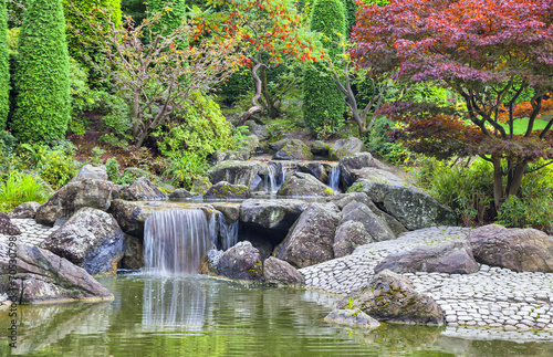 Naklejka dekoracyjna Cascade waterfall in Japanese garden in Bonn