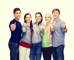 Wall Mural - group of smiling students showing thumbs up