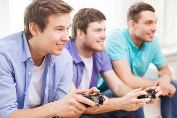 Poster - smiling friends playing video games at home