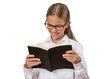 © pathdoc - Girl with glasses reading book isolated on white background
