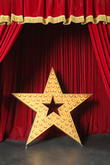 Wall Mural - Beautiful big shining star on red stage in retro style