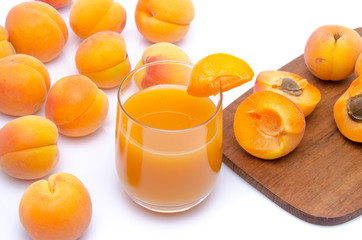 Poster - Glass of apricot juice with whole and sliced apricots