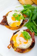 Eggs benedict with bacon and spinach