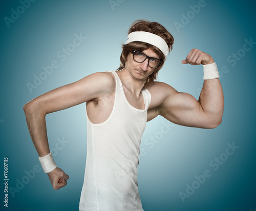 Fototapeta na wymiar Funny retro nerd with one huge arm flexing his muscle