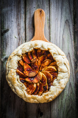 Wall Mural - Apple pie on rustic wooden background