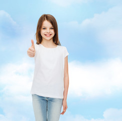 Wall Mural - smiling little girl in white blank t-shirt