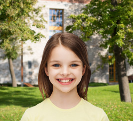 Wall Mural - smiling little girl over white background