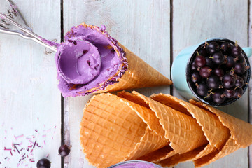 Wall Mural - Tasty ice cream with fresh berries on old wooden table