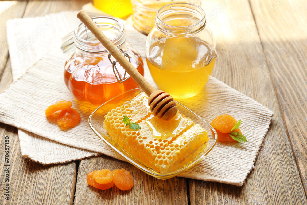 Fresh honey on wooden table
