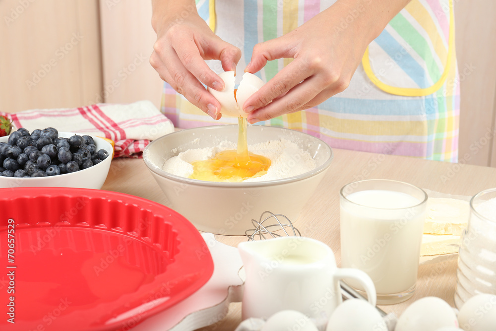 Baking tasty pie and ingredients for it on table in kitchen