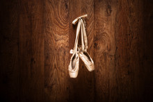 Ballet Shoes Hanged On A Wooden Wall