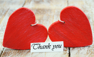 Wall Mural - thank you card with two read hearts on wooden surface