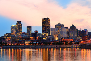 Fototapete - Montreal over river at sunset