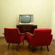 © Khorzhevska - Vintage room with two old fashioned armchairs and retro tvover o
