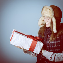 Portrait Of Attractive Cheerful Christmas Girl In Winter Hat Hol