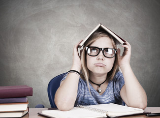 portrait of girl on desk at school