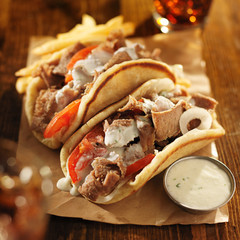 Wall Mural - greek gyros with tzatkiki sauce, cola and fries