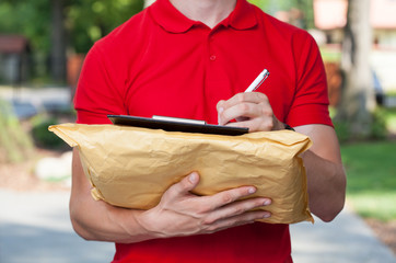 Wall Mural - Delivery guy does his paperwork