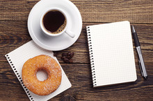 Notepad And Coffee With Donut