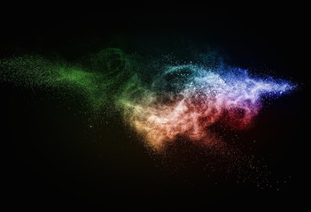 Wall Mural - colourful powder exploding isolated on black