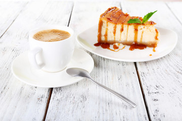 Poster - Cheese cake and cup of coffee on wooden background