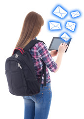 schoolgirl sending messages with tablet computer isolated on whi