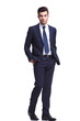 © Viorel Sima - elegant business man walking with his hands in his pocket