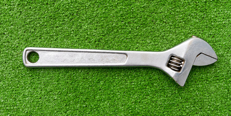 Spanner on artificial grass.