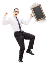 Wall Mural - Overjoyed businessman with briefcase full of money