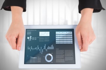 Poster - Composite image of businesswomans hands holding tablet