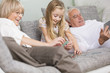 © Westend61 - Senior woman and granddaughter playing together on sofa in living room