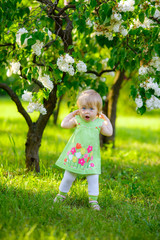 beautiful little girl walk in the park