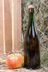 Wall Mural - bottle of cider with a apple and straw