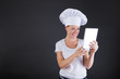 © Wisiel - woman chef with tablet over dark background