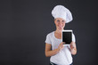 © Wisiel - woman chef with tablet over dark background