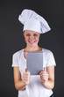 © Wisiel - cooking, technology and food concept - smiling female chef, cook