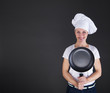 © Wisiel - cooking and food concept - smiling female chef, cook or baker wi