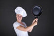 © Wisiel - cooking and food concept - smiling female chef, cook or baker wi