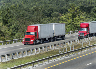 Wall Mural - Two Red Semi Trucks On The Interstate