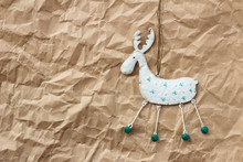 Christmas Decorations. Deer On Brown Paper With Copy Space