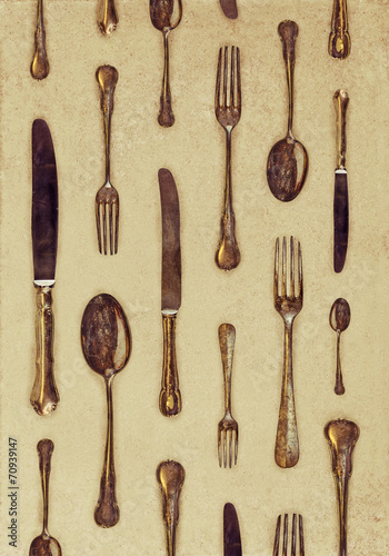 Fototapeta na wymiar Vintage styled image of forks, knives and spoons