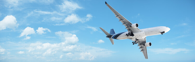 Fototapete - Jet in a blue cloudy sky