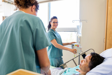 Sticker - Nurses Examining Patient In Hospital